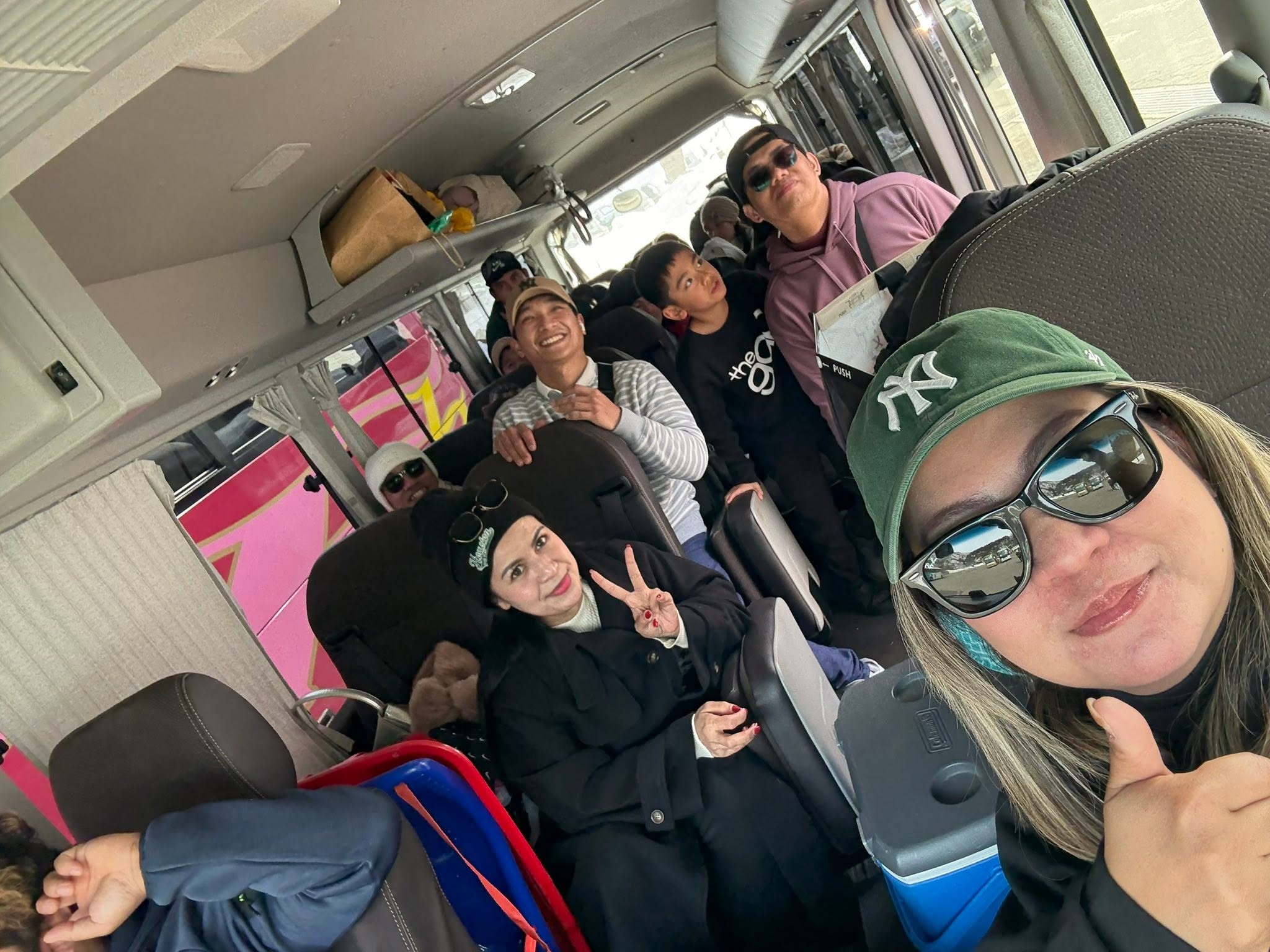 GG with travelers inside the tour van